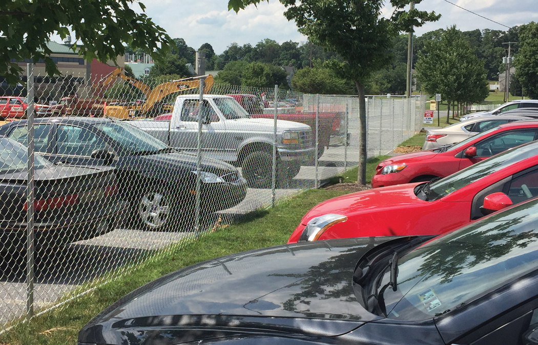 driven fence used for parking delineation